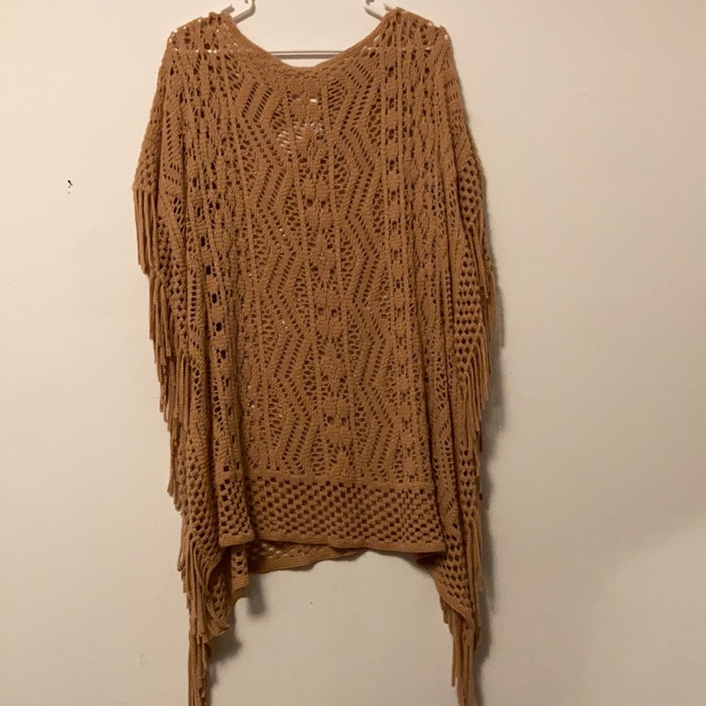 Woman’s see through poncho style cover